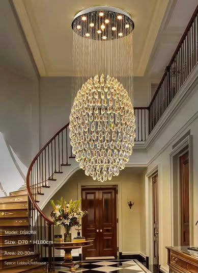 Grand crystal chandelier over a spiral staircase